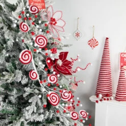 Northlight 30" Candy Cane Swirls And Pom Poms Christmas Garland -Christmas Decor Sale northlight df94827 styled 28794.1693409622