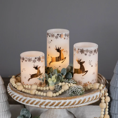 Northlight LED Reindeer Flameless Flickering Wax Pillar Christmas Candles - 6" - Set Of 3 5 Northlight LED Reindeer Flameless Flickering Wax Pillar Christmas Candles - 6" - Set Of 3 - Image 3